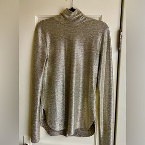 Sexy and sophisticated gold tone top